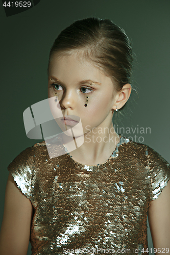 Image of The fashion portrait of young beautiful teen girl at studio