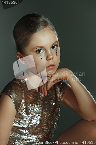 Image of The fashion portrait of young beautiful teen girl at studio