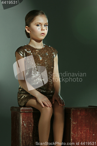 Image of The fashion portrait of young beautiful teen girl at studio