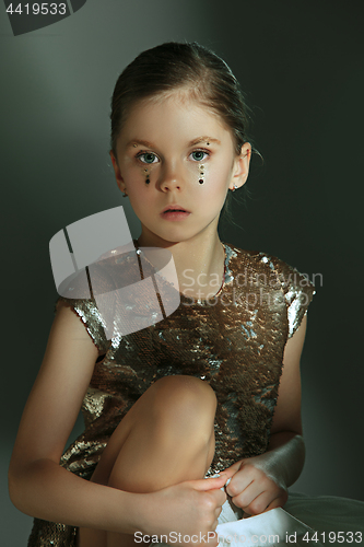 Image of The fashion portrait of young beautiful teen girl at studio