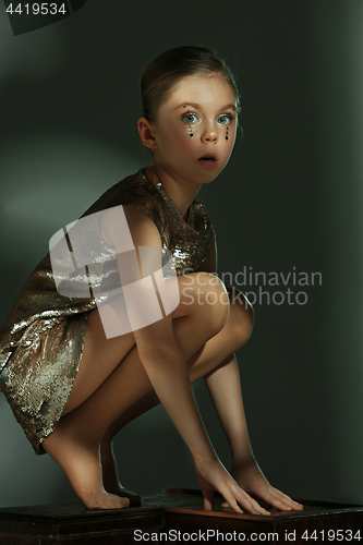 Image of The fashion portrait of young beautiful teen girl at studio