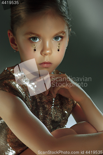 Image of The fashion portrait of young beautiful teen girl at studio