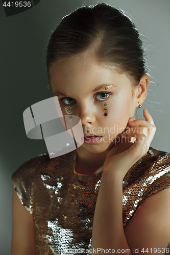 Image of The fashion portrait of young beautiful teen girl at studio