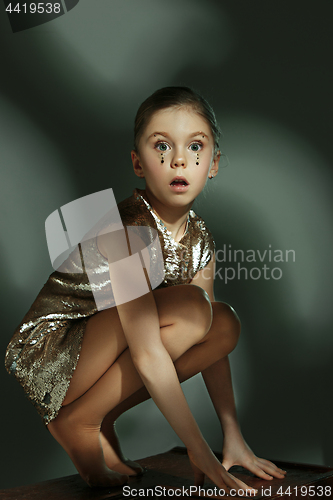 Image of The fashion portrait of young beautiful teen girl at studio