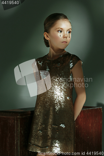 Image of The fashion portrait of young beautiful teen girl at studio