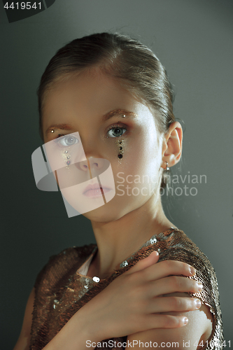 Image of The fashion portrait of young beautiful teen girl at studio