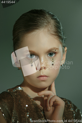 Image of The fashion portrait of young beautiful teen girl at studio