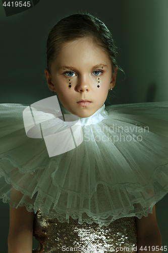 Image of The fashion portrait of young beautiful teen girl at studio