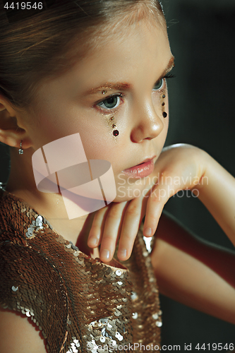 Image of The fashion portrait of young beautiful teen girl at studio