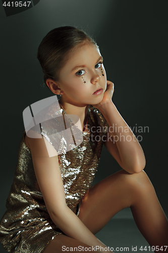 Image of The fashion portrait of young beautiful teen girl at studio