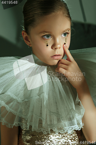 Image of The fashion portrait of young beautiful teen girl at studio