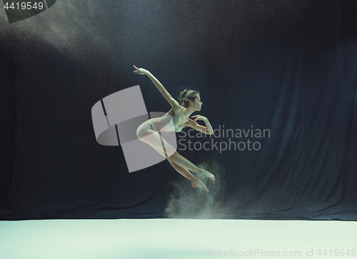 Image of Young teen dancer on white floor background.