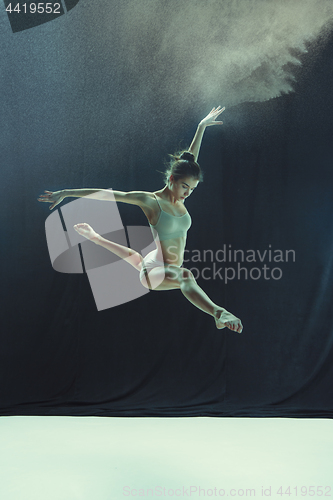 Image of Young teen dancer on white floor background.