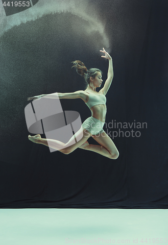 Image of Young teen dancer on white floor background.