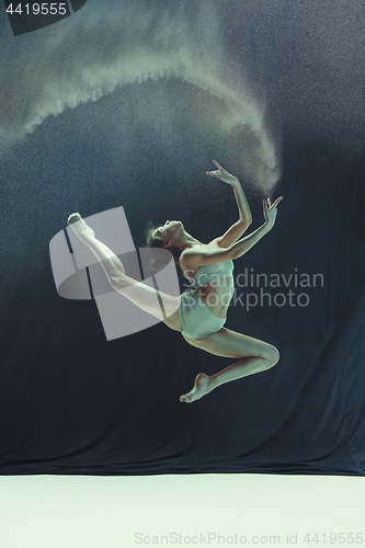 Image of Young teen dancer on white floor background.