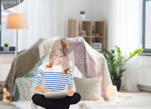 Image of student girl with tablet pc at home