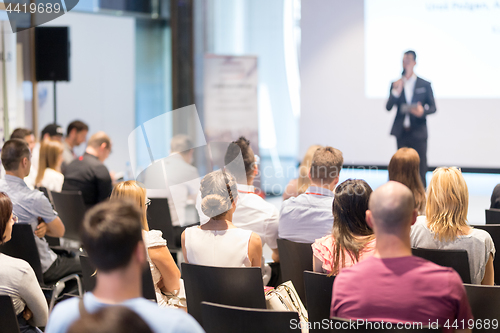 Image of Business speaker giving a talk at business conference event.