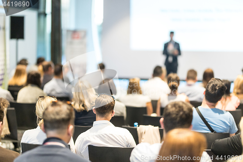 Image of Business speaker giving a talk at business conference event.