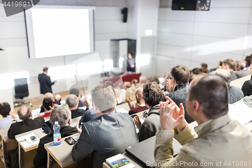 Image of Business speaker giving a talk at business conference event.