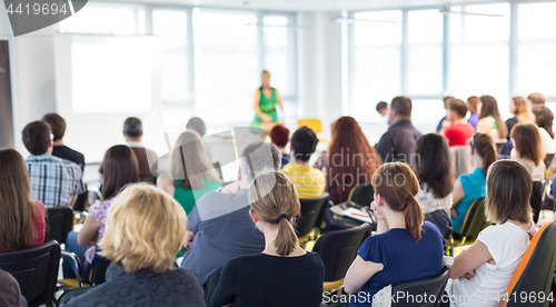 Image of Speaker giving presentation on business conference.