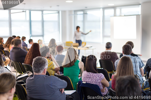 Image of Speaker giving presentation on business conference.