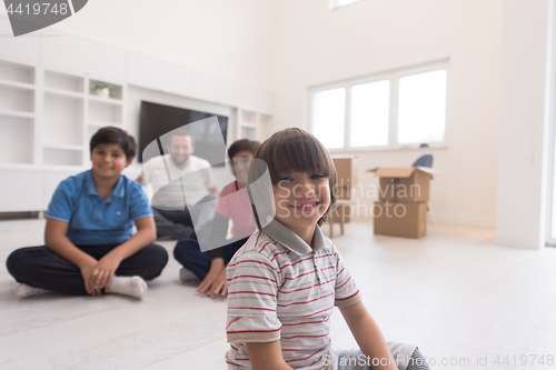 Image of portrait of happy young boys with their dad