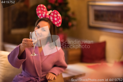 Image of woman drinking champagne at spa