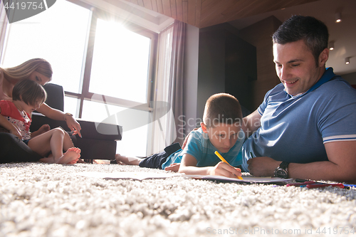 Image of young couple spending time with kids