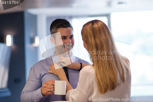 Image of A young couple is preparing for a job and using a laptop