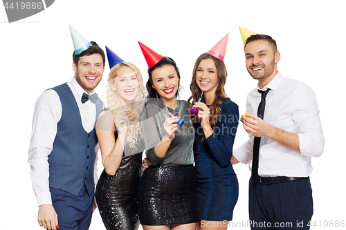 Image of happy couple with party blowers having fun