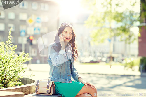 Image of happy young woman or girl calling on smartphone