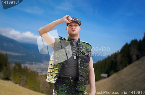 Image of soldier in military uniform outdoors