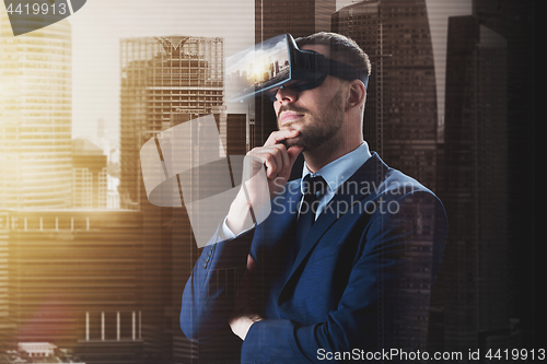 Image of businessman in virtual reality glasses or headset