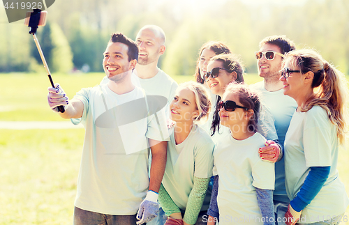 Image of group of volunteers taking smartphone selfie