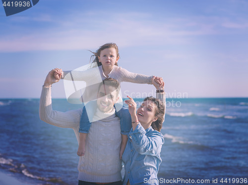 Image of Young family enjoying vecation during autumn day