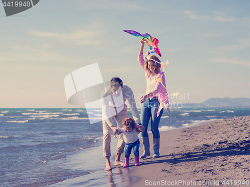 Image of happy family enjoying vecation during autumn day