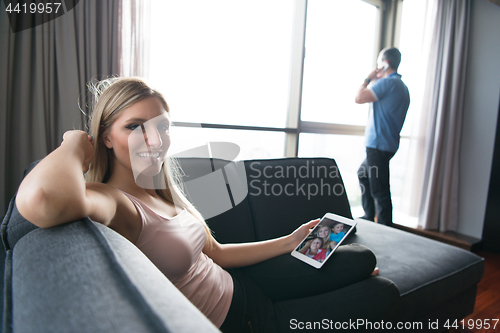 Image of woman using tablet in beautiful apartment