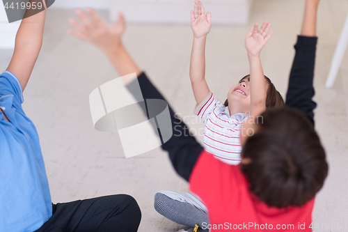 Image of young boys having fun on the floor