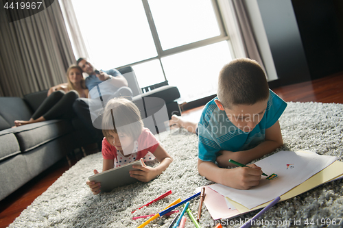 Image of young couple spending time with kids