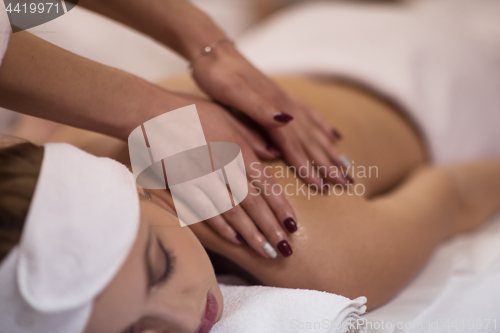 Image of woman receiving a back massage