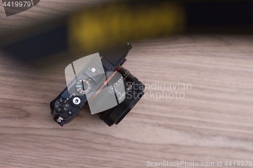 Image of camera on a wooden table