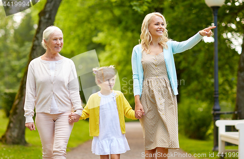 Image of happy mother, daughter and grandmother at park