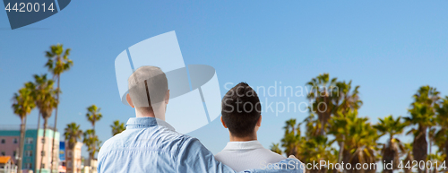 Image of close up of gay couple hugging over los angeles