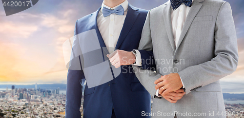 Image of close up of male gay couple over san francisco