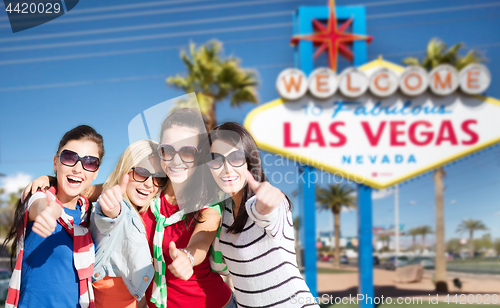 Image of group of happy women or friends at las vegas