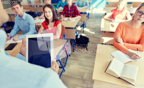 Image of students and teacher with tablet pc at school