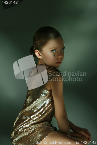 Image of The fashion portrait of young beautiful teen girl at studio