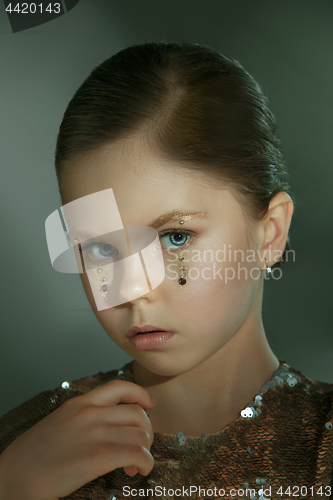 Image of The fashion portrait of young beautiful teen girl at studio