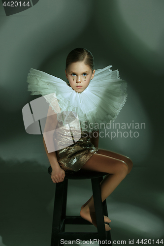 Image of The fashion portrait of young beautiful teen girl at studio