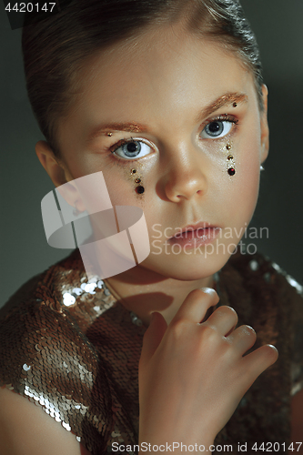 Image of The fashion portrait of young beautiful teen girl at studio